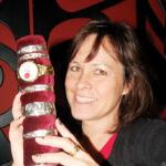 View the image: Leanne holding bracelets in her studio 2011